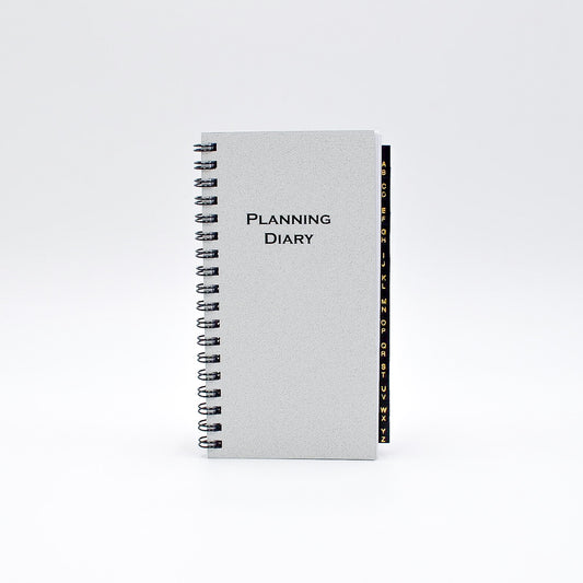 McCarthy Planner- Item MWA36W 12 Month Planner  White paper. Size 6-1/4" x 3-1/4" 144 pages; Weekly and Monthly View Format. One agenda planner; two formats. Also includes a 3 Yearly View, 12 Monthly View, 52 Weekly View. And includes Advance Planning, Important Dates, International Holidays, Birthdays and Anniversaries, Weights and Measures, Weather, Interest Rates, Road and Air Miles...and more!  INCLUDES Address Section with Leatherette Tabs.  Made in the USA!
