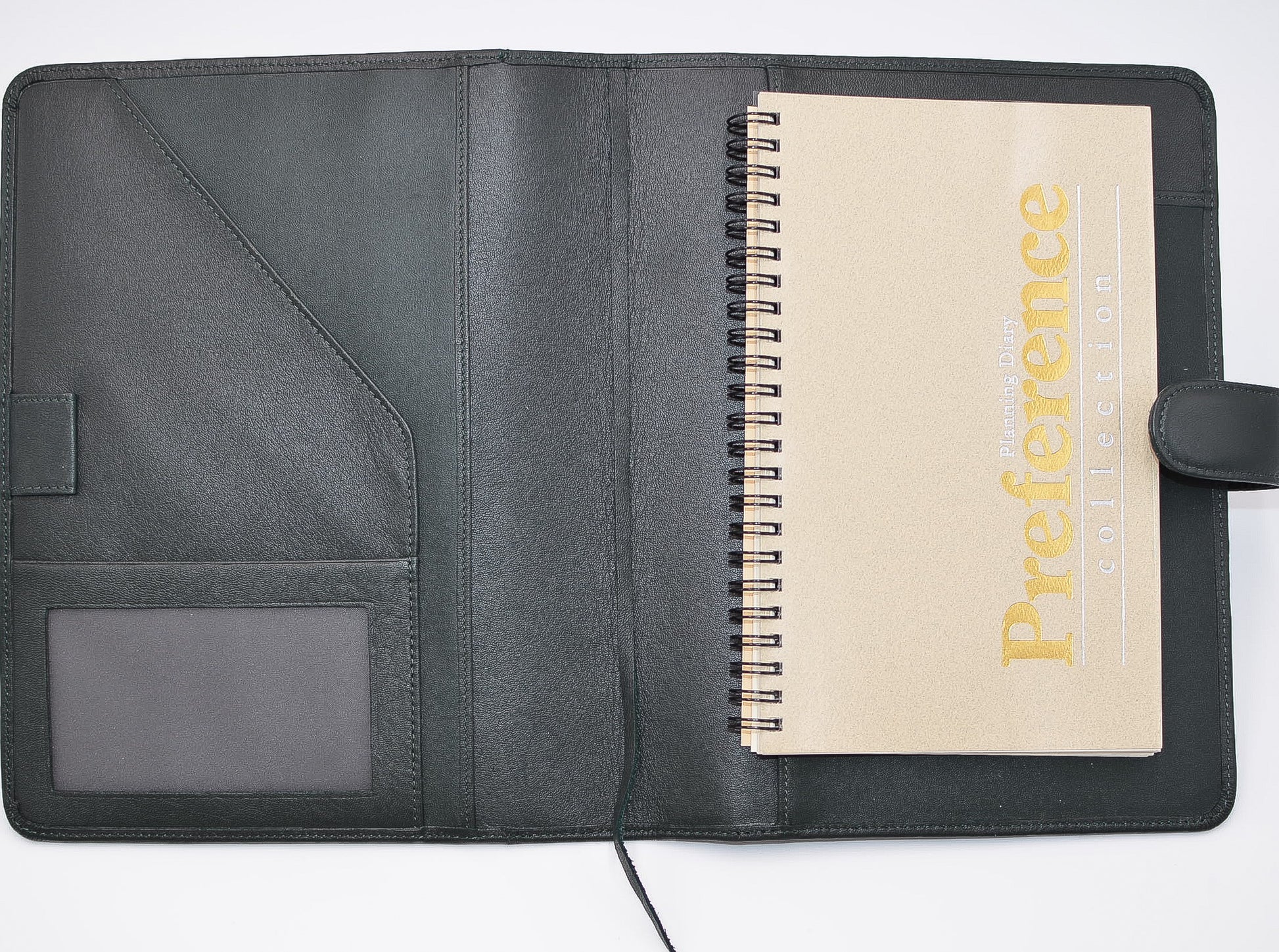 This leather cover is available in British Tan, Red, Burgundy, Green, Black, and Brown. This 7-1/2" x 9-3/4" cover accommodates wire bound and loose leaf inserts with an optional metal 3-ring binder. Keep yourself organized with ease with a snap closure, horizontal note pad holder, clear identification holder, document holder, and leather book mark.