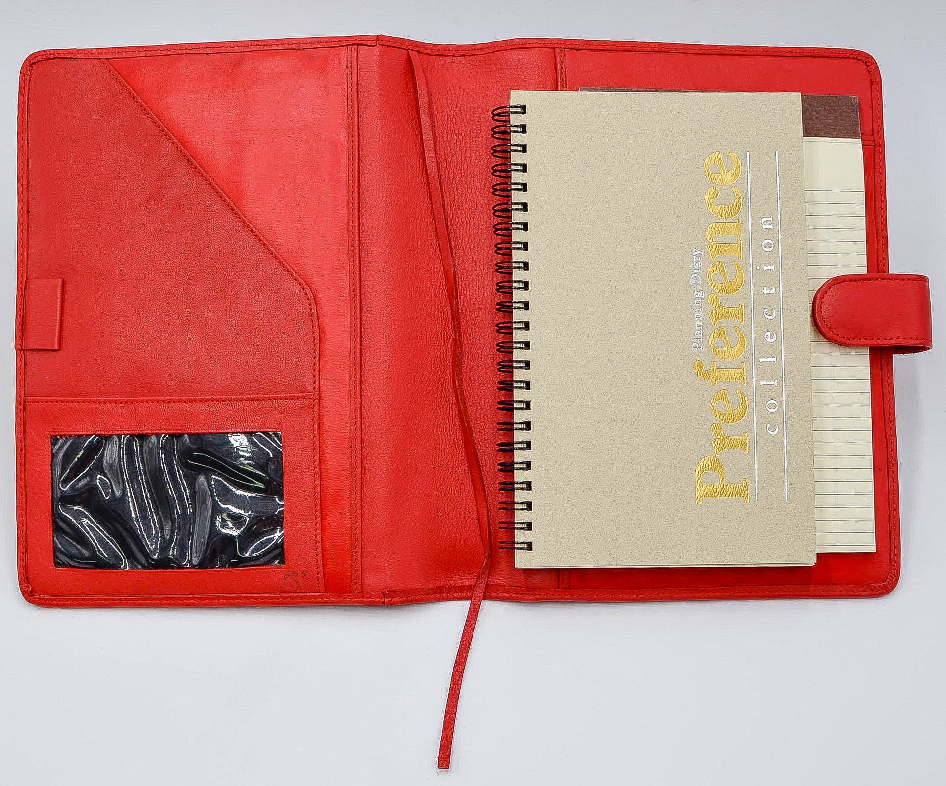 This leather cover is available in British Tan, Red, Burgundy, Green, Black, and Brown. This 7-1/2" x 9-3/4" cover accommodates wire bound and loose leaf inserts with an optional metal 3-ring binder. Keep yourself organized with ease with a snap closure, horizontal note pad holder, clear identification holder, document holder, and leather book mark.