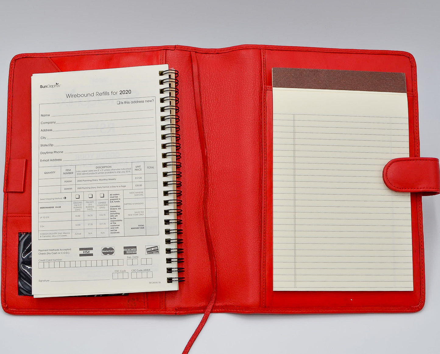 This leather cover is available in British Tan, Red, Burgundy, Green, Black, and Brown. This 7-1/2" x 9-3/4" cover accommodates wire bound and loose leaf inserts with an optional metal 3-ring binder. Keep yourself organized with ease with a snap closure, horizontal note pad holder, clear identification holder, document holder, and leather book mark.