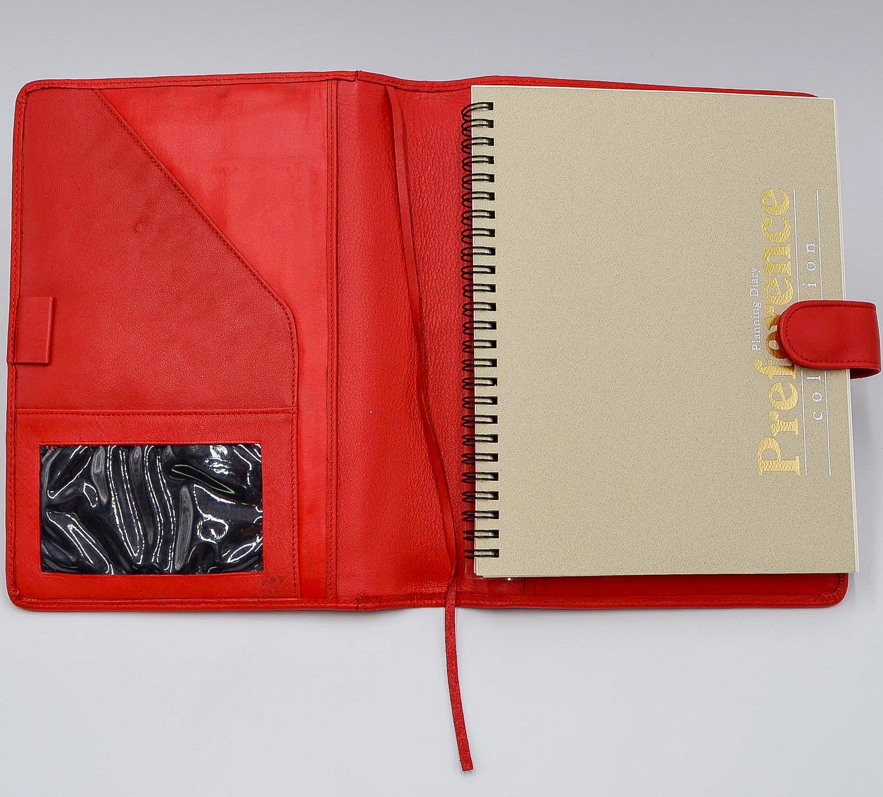 This leather cover is available in British Tan, Red, Burgundy, Green, Black, and Brown. This 7-1/2" x 9-3/4" cover accommodates wire bound and loose leaf inserts with an optional metal 3-ring binder. Keep yourself organized with ease with a snap closure, horizontal note pad holder, clear identification holder, document holder, and leather book mark.