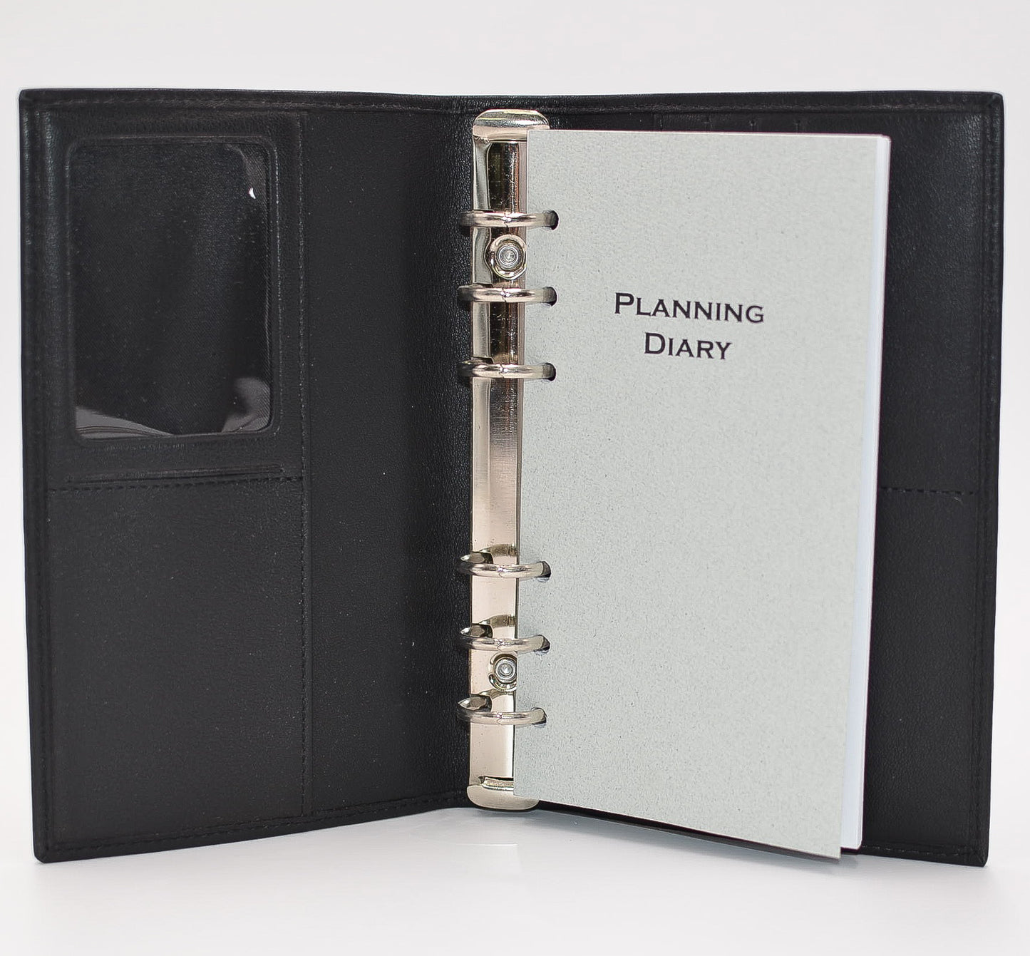 Leather 6-ring Cover   This black leather cover includes business card holders, document pocket, and clear Identification holder. This cover has 6 metal rings that accommodate 3-3/4" x 6-3/4" inserts.  Dimensions: 4" x 6-1/2"  Insert Size: 3-3/4" x 6-3/4"  Cover Color: Black  Rings: Metal  Compatible with items: PD646I, MP46P6, MW46P6