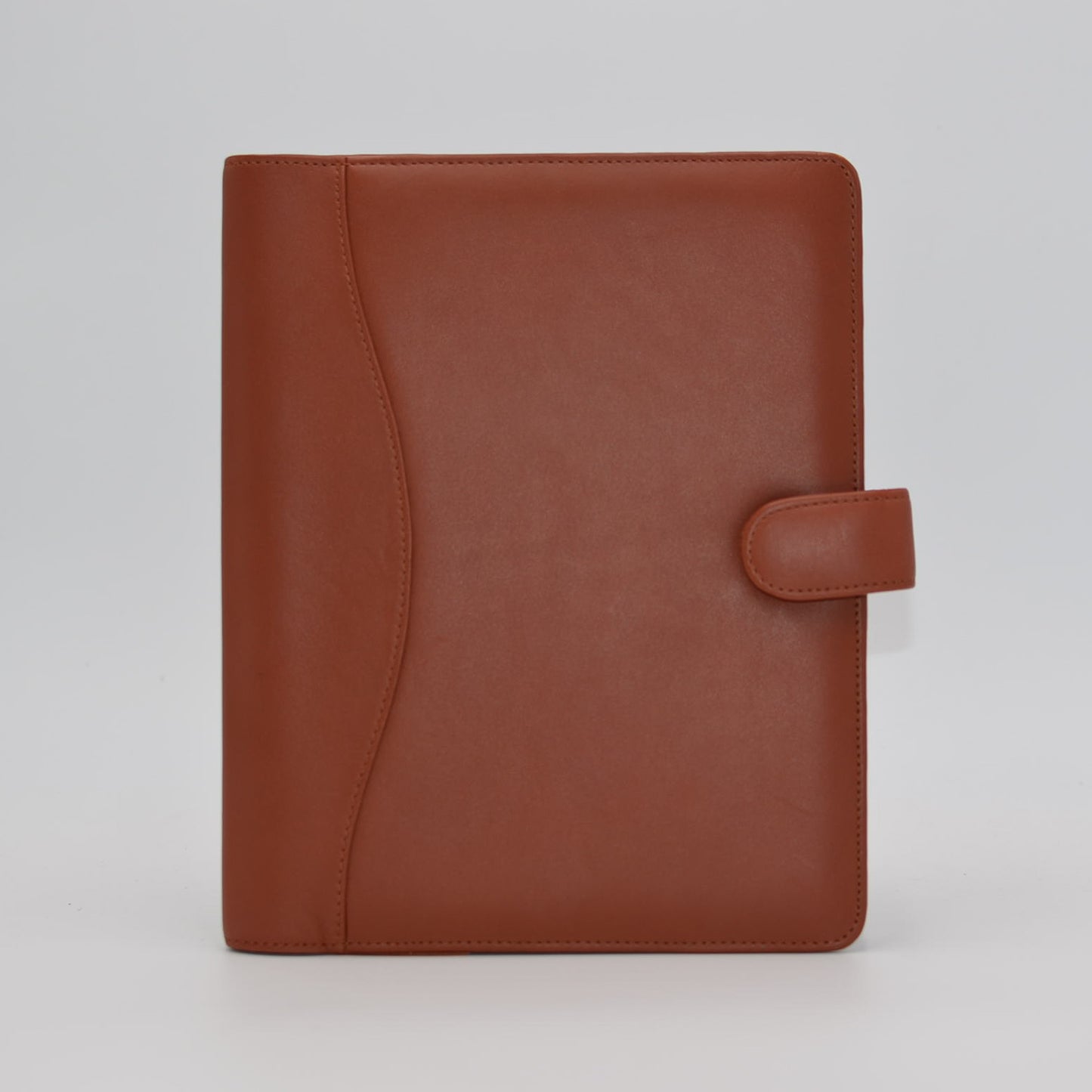 This leather cover is available in British Tan, Red, Burgundy, Green, Black, and Brown. This 7-1/2" x 9-3/4" cover accommodates wire bound and loose leaf inserts with an optional metal 3-ring binder. Keep yourself organized with ease with a snap closure, horizontal note pad holder, clear identification holder, document holder, and leather book mark.