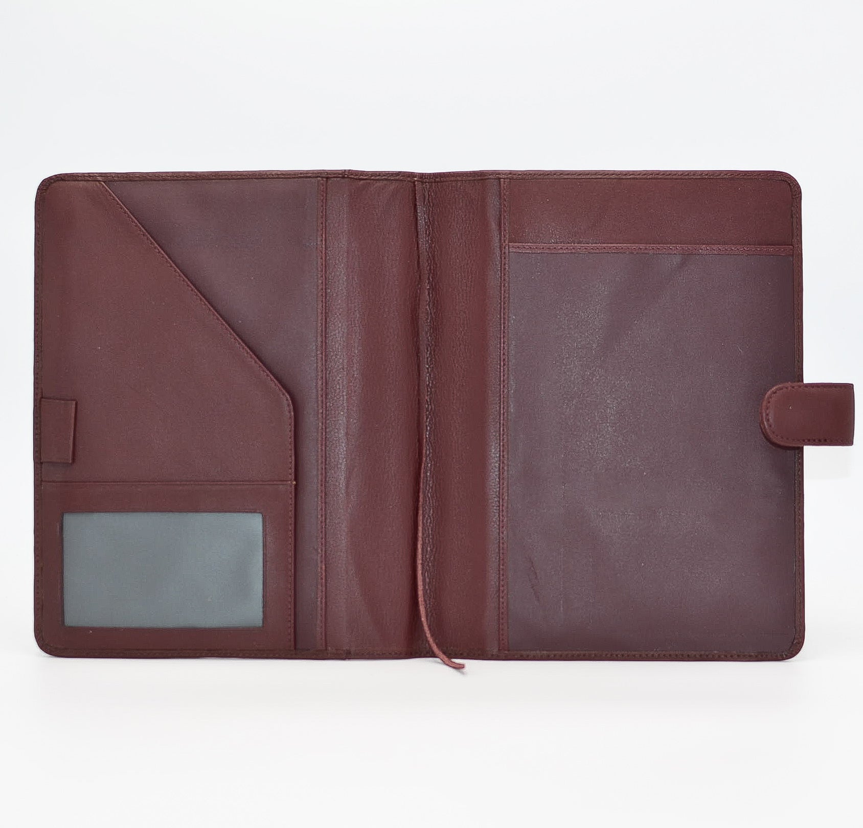 This leather cover is available in British Tan, Red, Burgundy, Green, Black, and Brown. This 7-1/2" x 9-3/4" cover accommodates wire bound and loose leaf inserts with an optional metal 3-ring binder. Keep yourself organized with ease with a snap closure, horizontal note pad holder, clear identification holder, document holder, and leather book mark.
