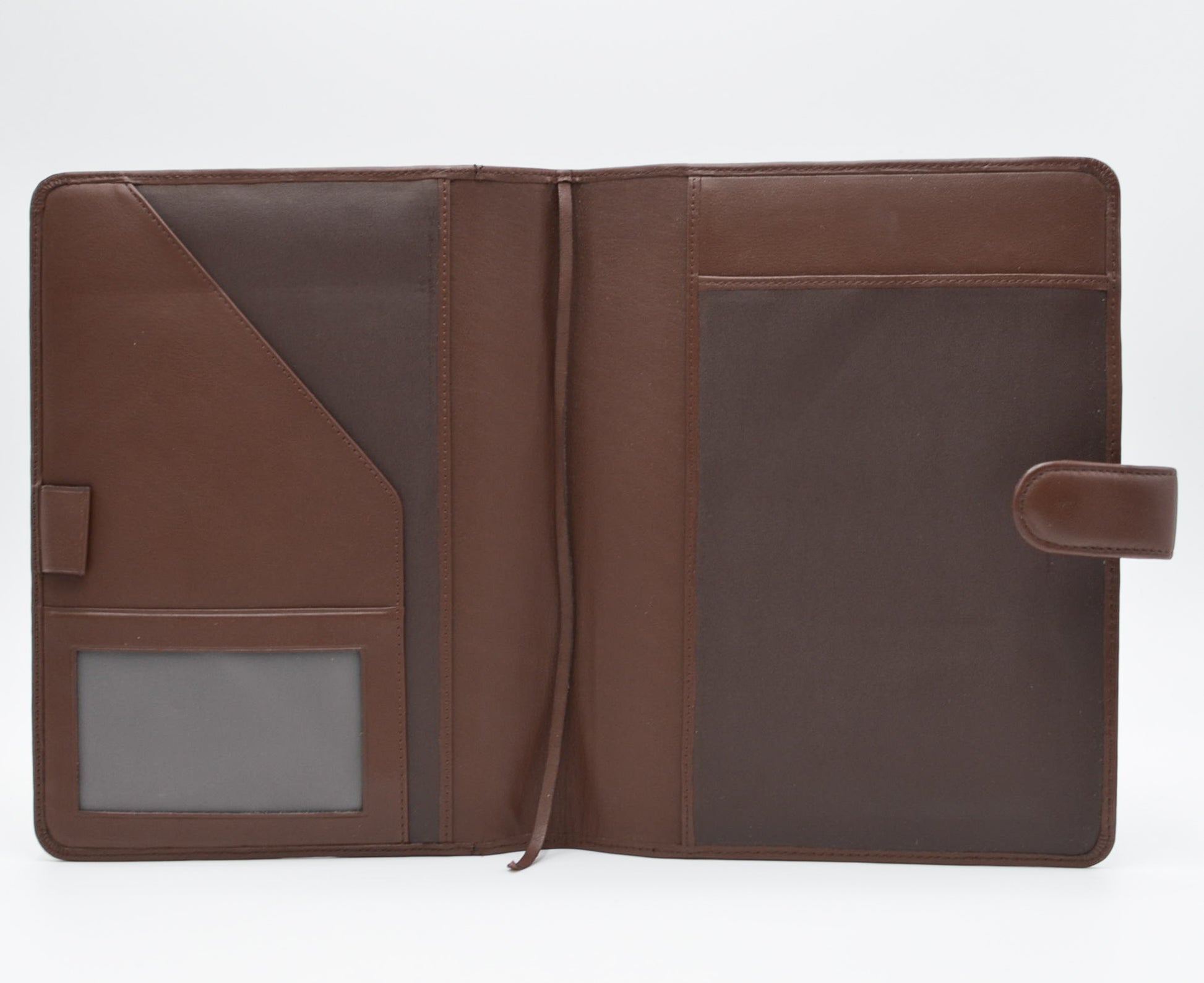 This leather cover is available in British Tan, Red, Burgundy, Green, Black, and Brown. This 7-1/2" x 9-3/4" cover accommodates wire bound and loose leaf inserts with an optional metal 3-ring binder. Keep yourself organized with ease with a snap closure, horizontal note pad holder, clear identification holder, document holder, and leather book mark.
