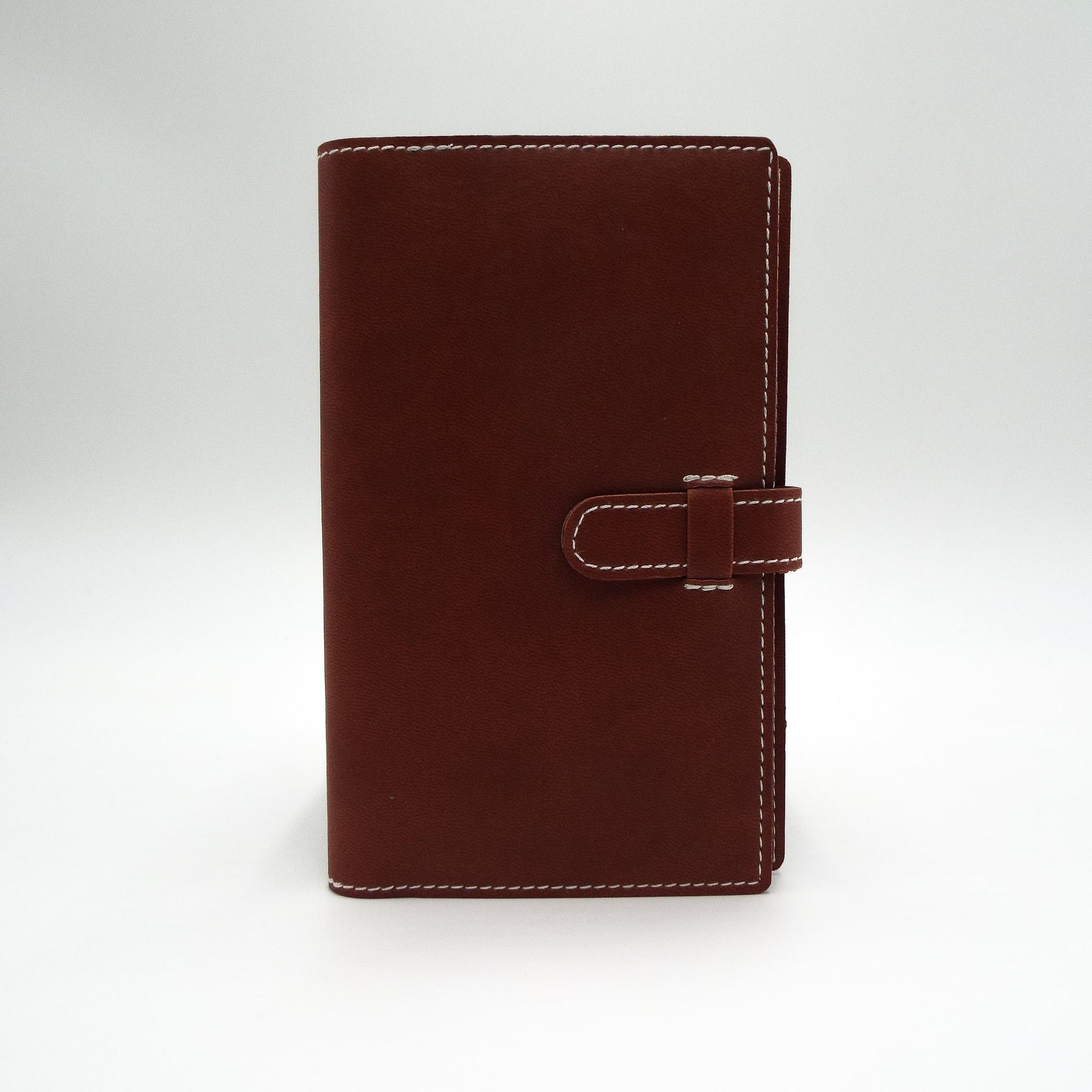 Faux Leather Cover   This  4" x 6-1/2" journal or planner cover is a great size for your desk, briefcase, purse, or car. With a vegan leather exterior, this economically and cruelty free cover is the perfect addition to your organizational system.  Dimensions:  4" x 6-1/2"  Insert Size: 3" x 6" to 3-1/2" x 6-1/2"  Cover Color: Black, Brown, or Navy  Manufacturer: Castelli