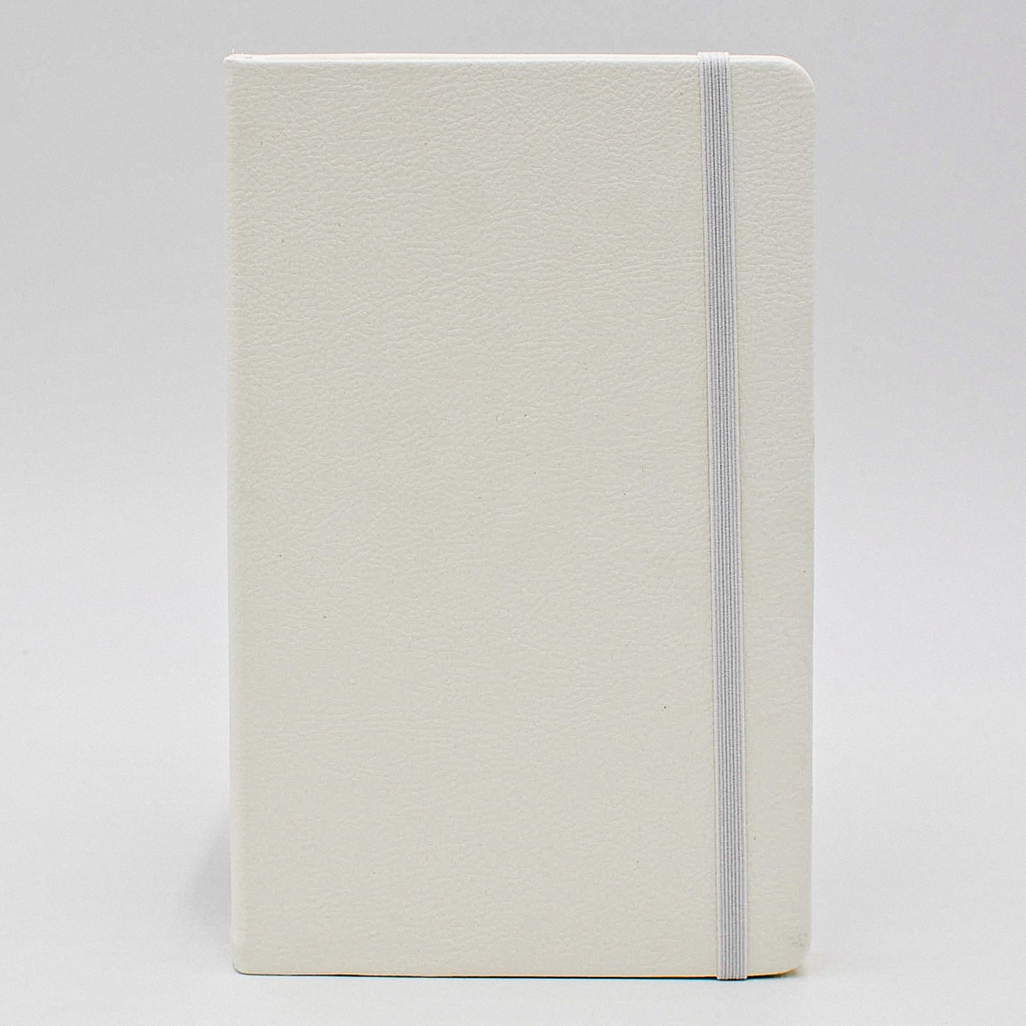 Journal: Faux Leather Lined Case Bound Book with Elastic Closure  This vegan leather ruled journal is perfect for your travels, home, car, or office. With a convenient elastic band closure, keep your book closed with ease. With ivory ruled pages, keep easy notes throughout your day.  Available in Tan, White, and Blue  Dimensions: 5" x 8"  white creme cream 5 x  8 5x8